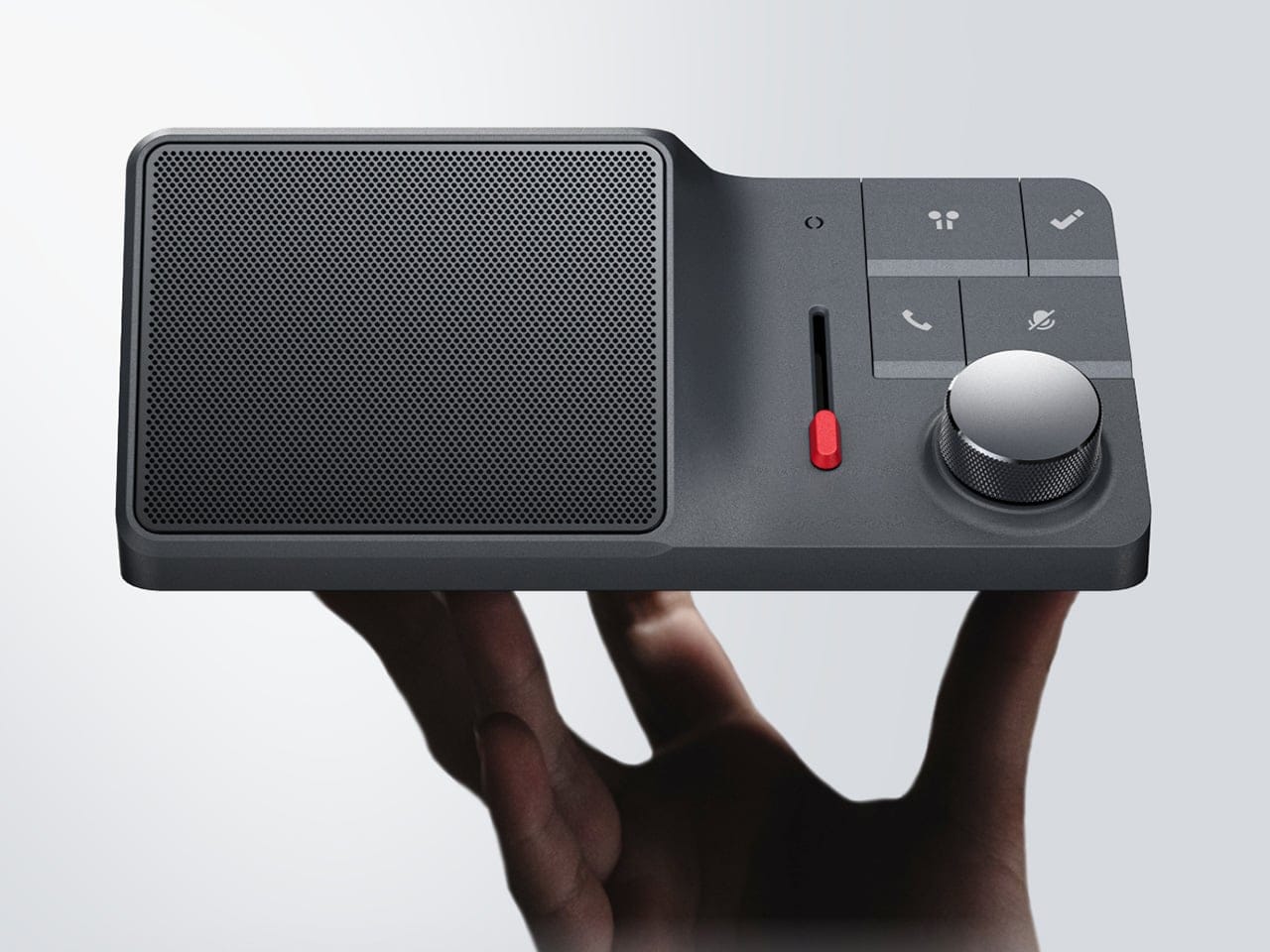 HiDock H1 Lite diletakkan di meja kerja sebagai pengontrol audio